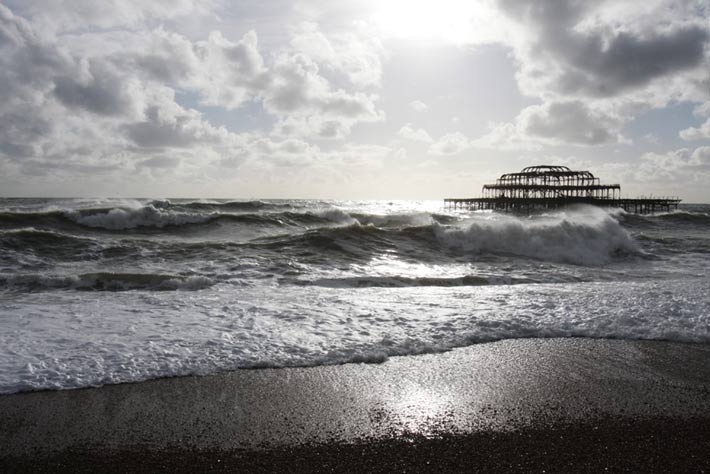Surfing Brighton west pier